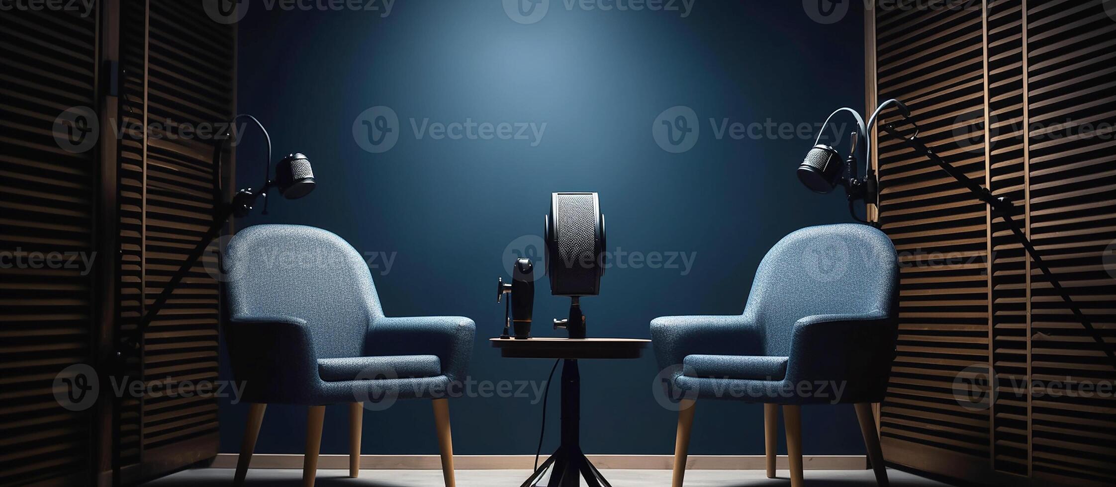 The interior of the podcast studio, two chairs with microphones, dark muted tones. photo