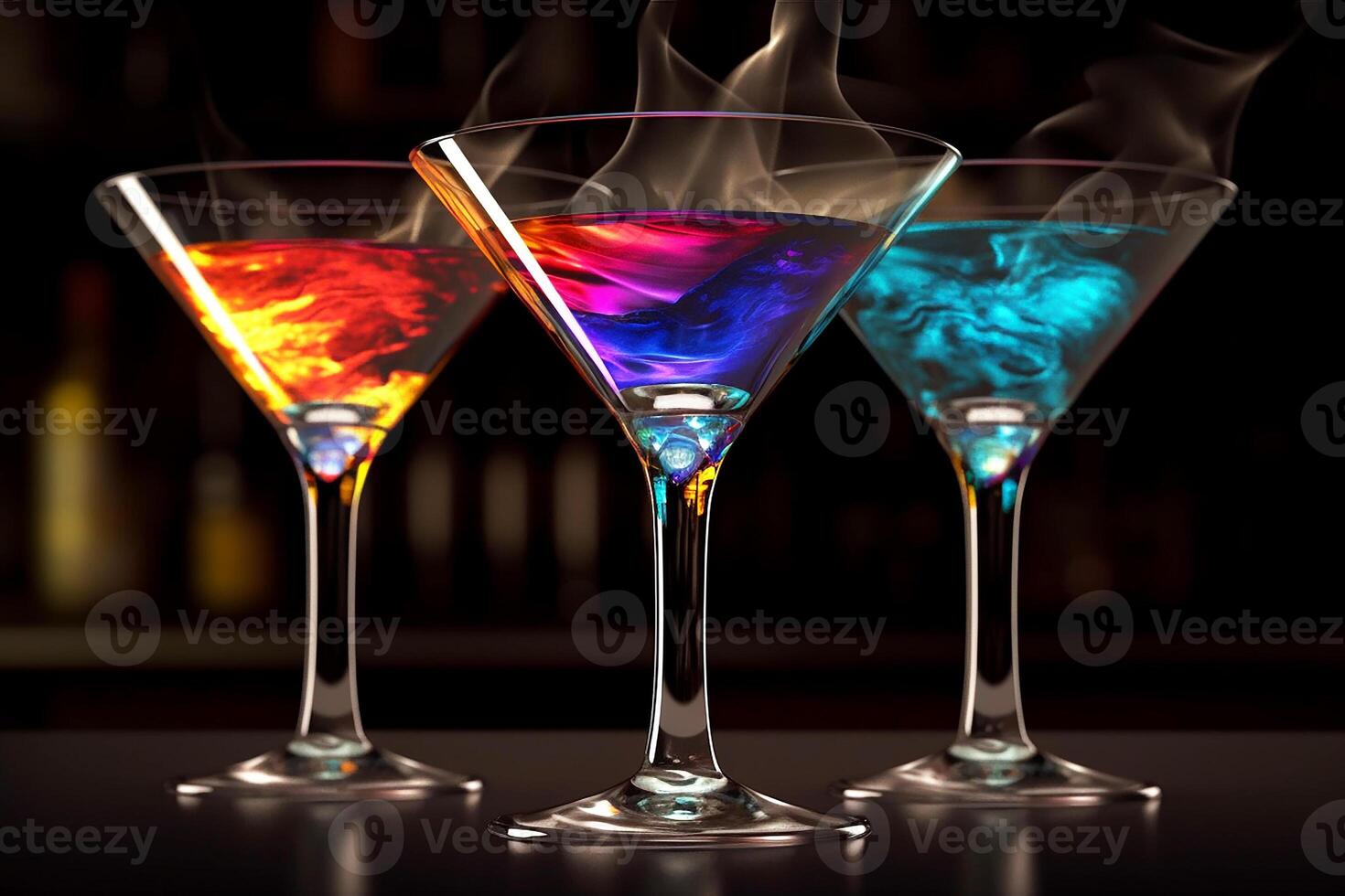 Bright cocktails in glass cocktail glasses. Black background. photo