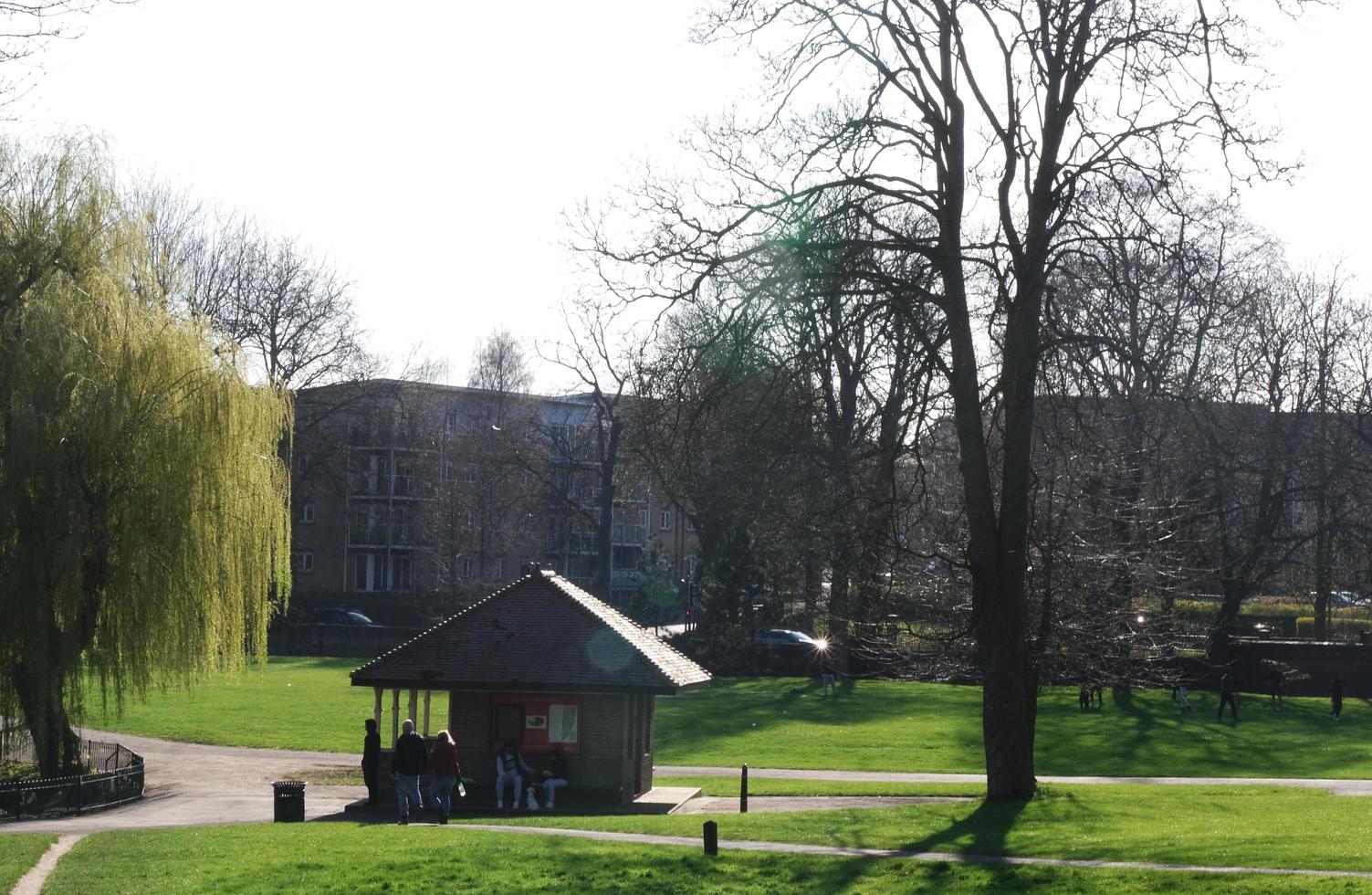 Gorgeous View of Wardown Public Park and People are Enjoying the Beautiful and Bright Sunny Day. They are Spending Day with Their Families and Having Fun. Image Was Captured at Luton on 03-April-2023 photo