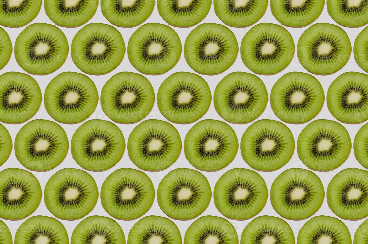Sliced Kiwi Pattern Isolated on White Background photo