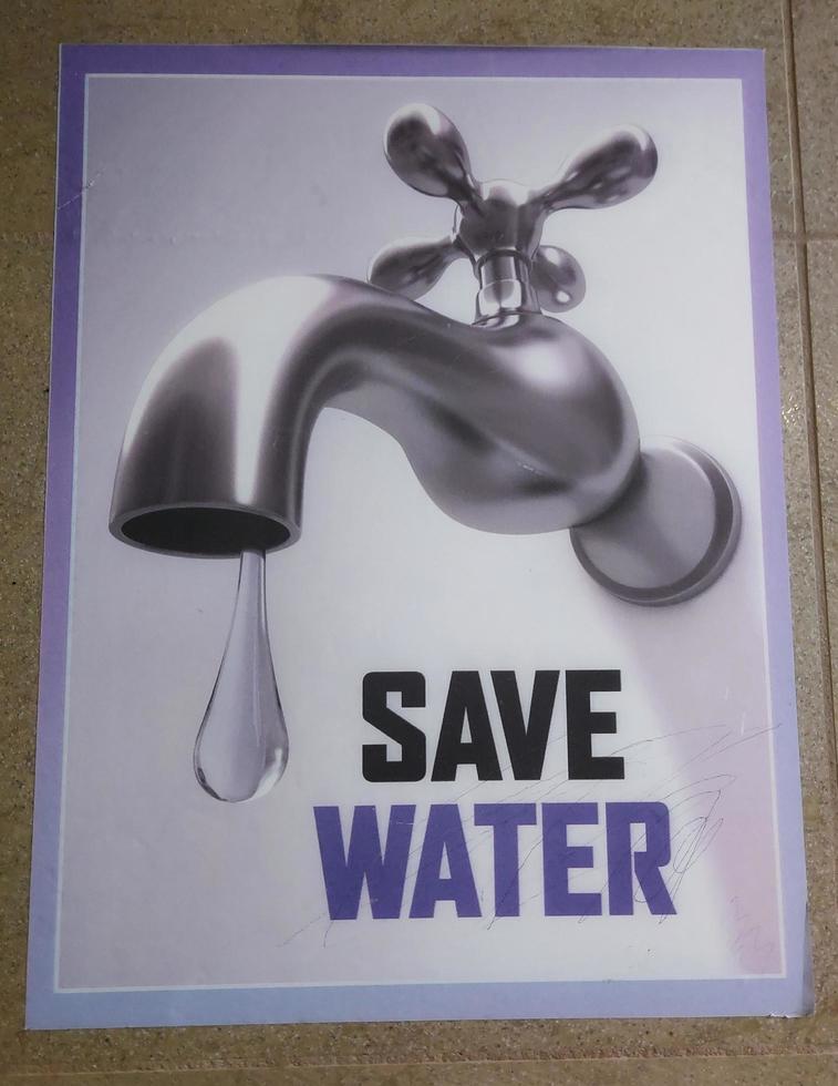 Save water poster in bathroom outdoor photo