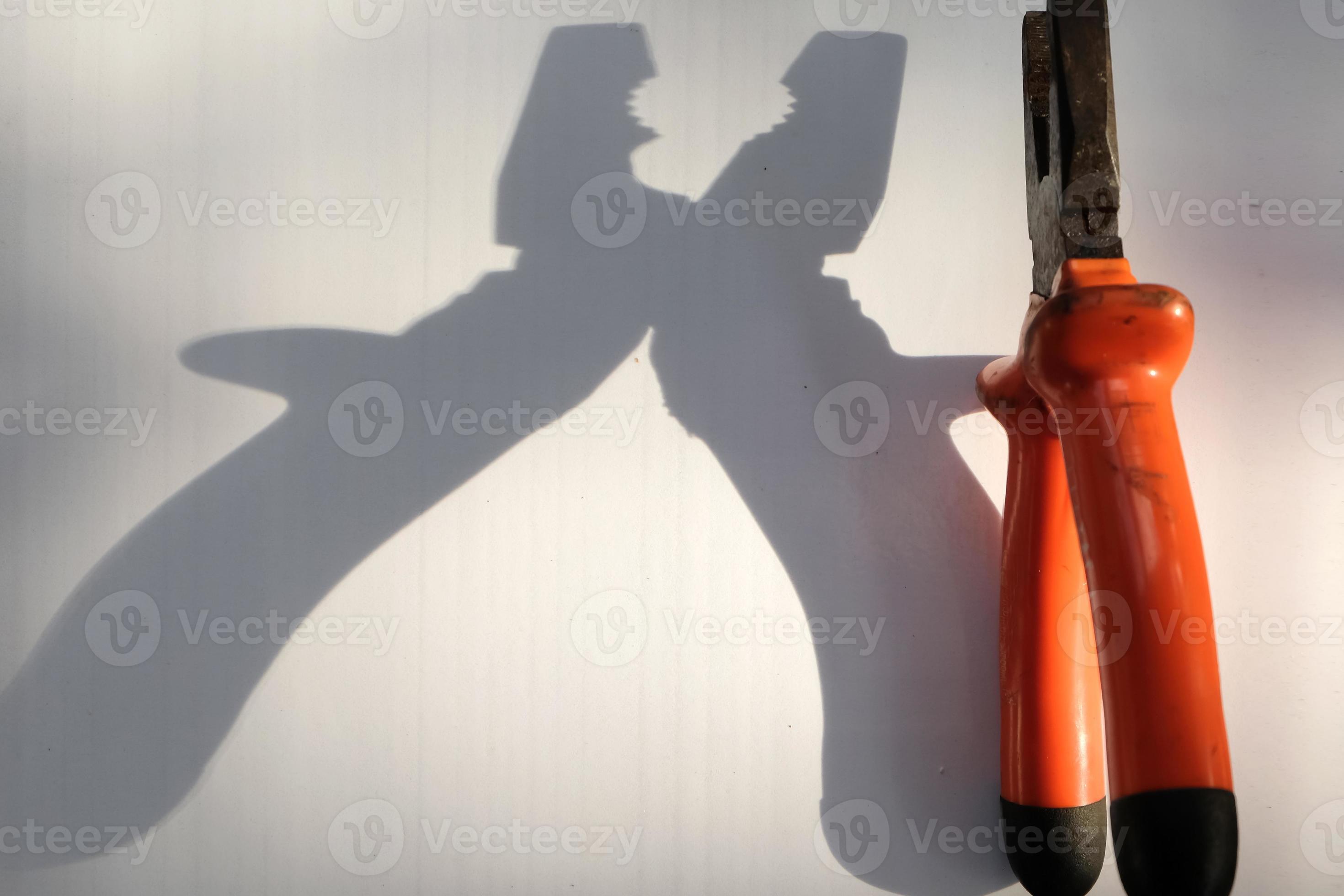 Old pliers with hard shadow on white background 22775416 Stock Photo at