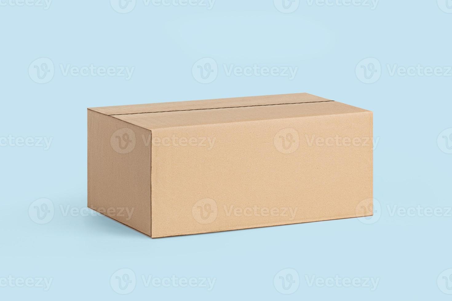 Cardboard box for delivery, parcels. On a blue, blue background photo