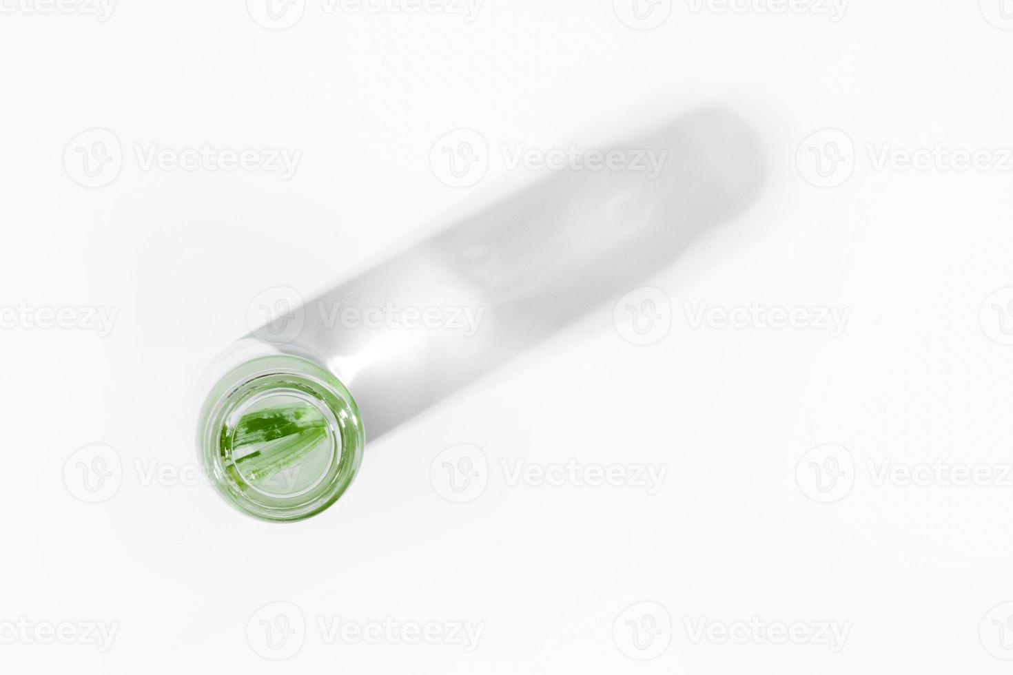 organic cosmetics, natural cosmetics, biofuels, algae. Natural green laboratory. Experiments. Glass laboratory jar with green plants on a light background. photo