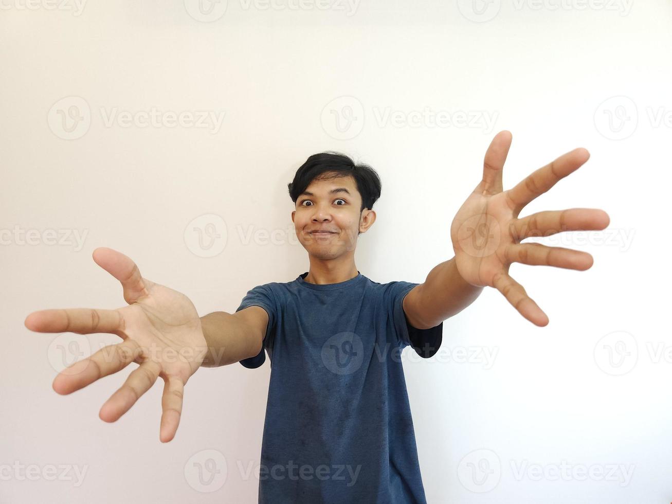 Funny surprised shocked asian man face for promotion isolated on background photo