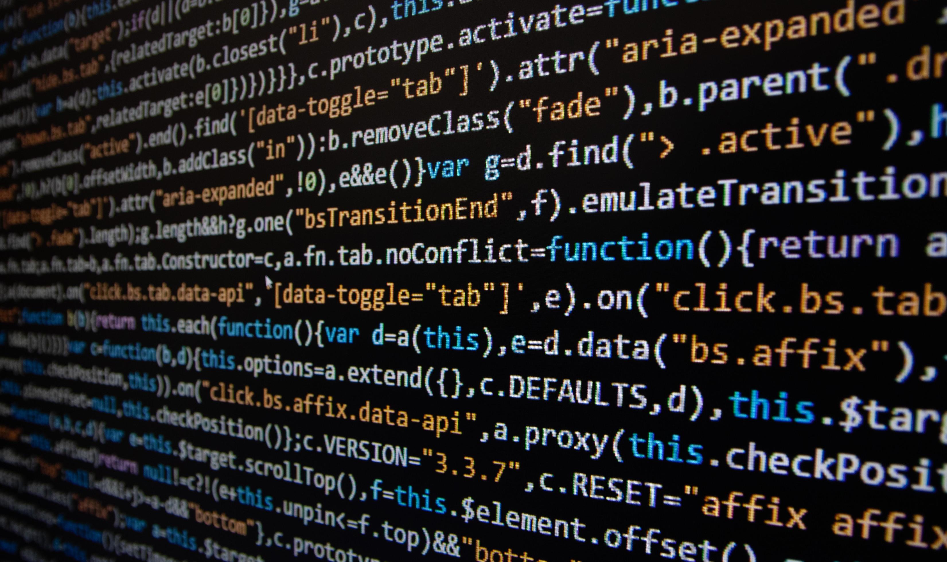 Computer program code on a black background. Close-up. High quality ...