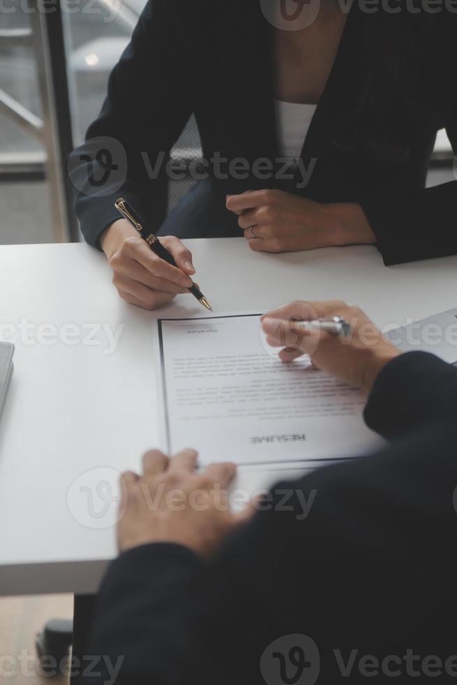 Close up view of job interview in office, focus on resume writing tips, employer reviewing good cv of prepared skilled applicant, recruiter considering application, hr manager making hiring decision photo