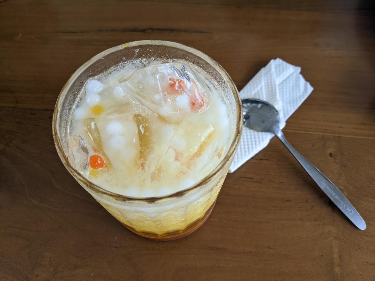 Yakult mango ice with fresh milk and little pulpy. The photo is suitable to use for coffee shop background, menu poster and coffee content media.