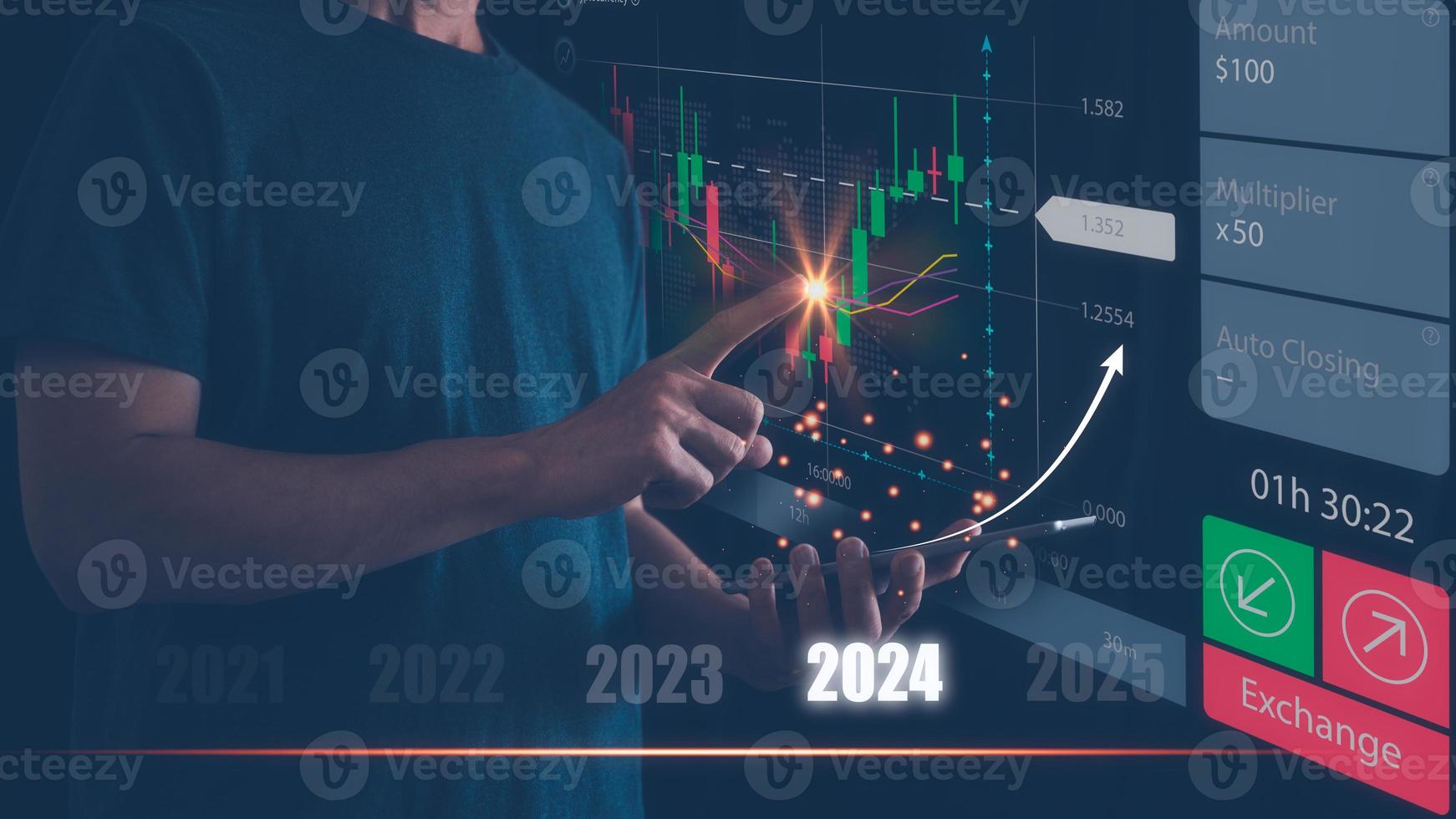 Businessman or trader is using smartphone and virtual hologram stock, invest in trading, planning analyze indicator and strategy for year 2024 buy and sell, Stock market, Business growth concept. photo