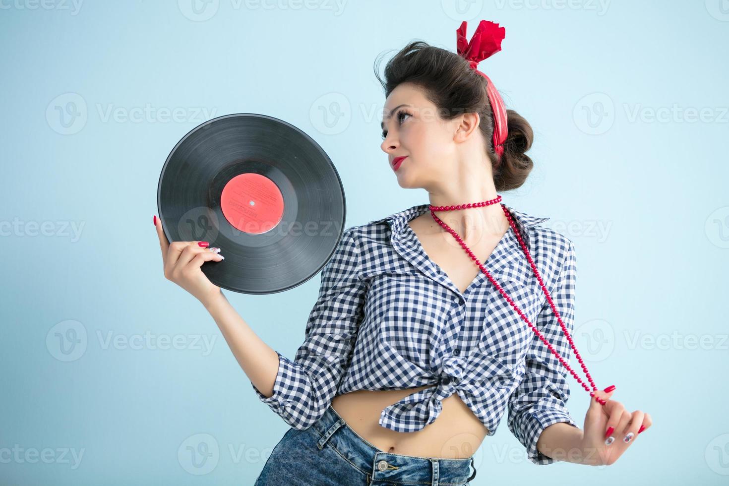 Retro woman with music record. photo