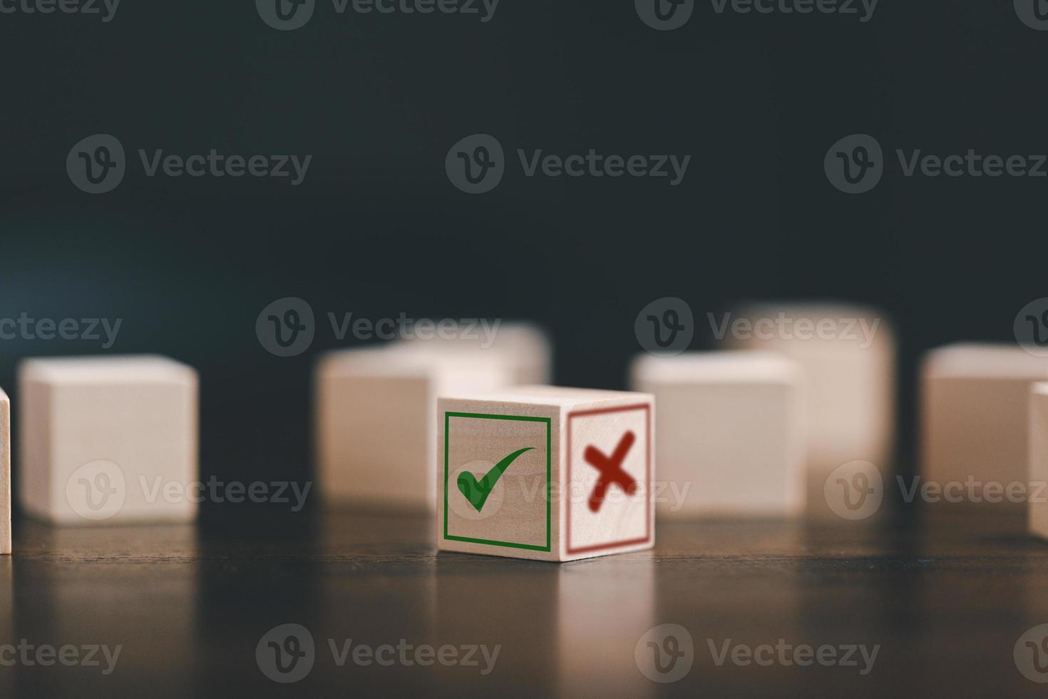 Wooden blocks show checks marks and are wrong. Business and lifestyle concept. Think With checks marks Or wrong Choice, Business Choices For Difficult Situations. photo