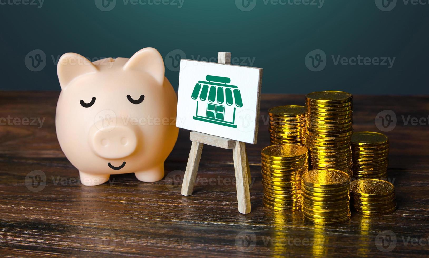 Profitable business. Piggy bank and golden money coins. Profits and taxes. Franchise market. Service industry. Conduct an research and open your own successful business. Entrepreneurship and trade. photo