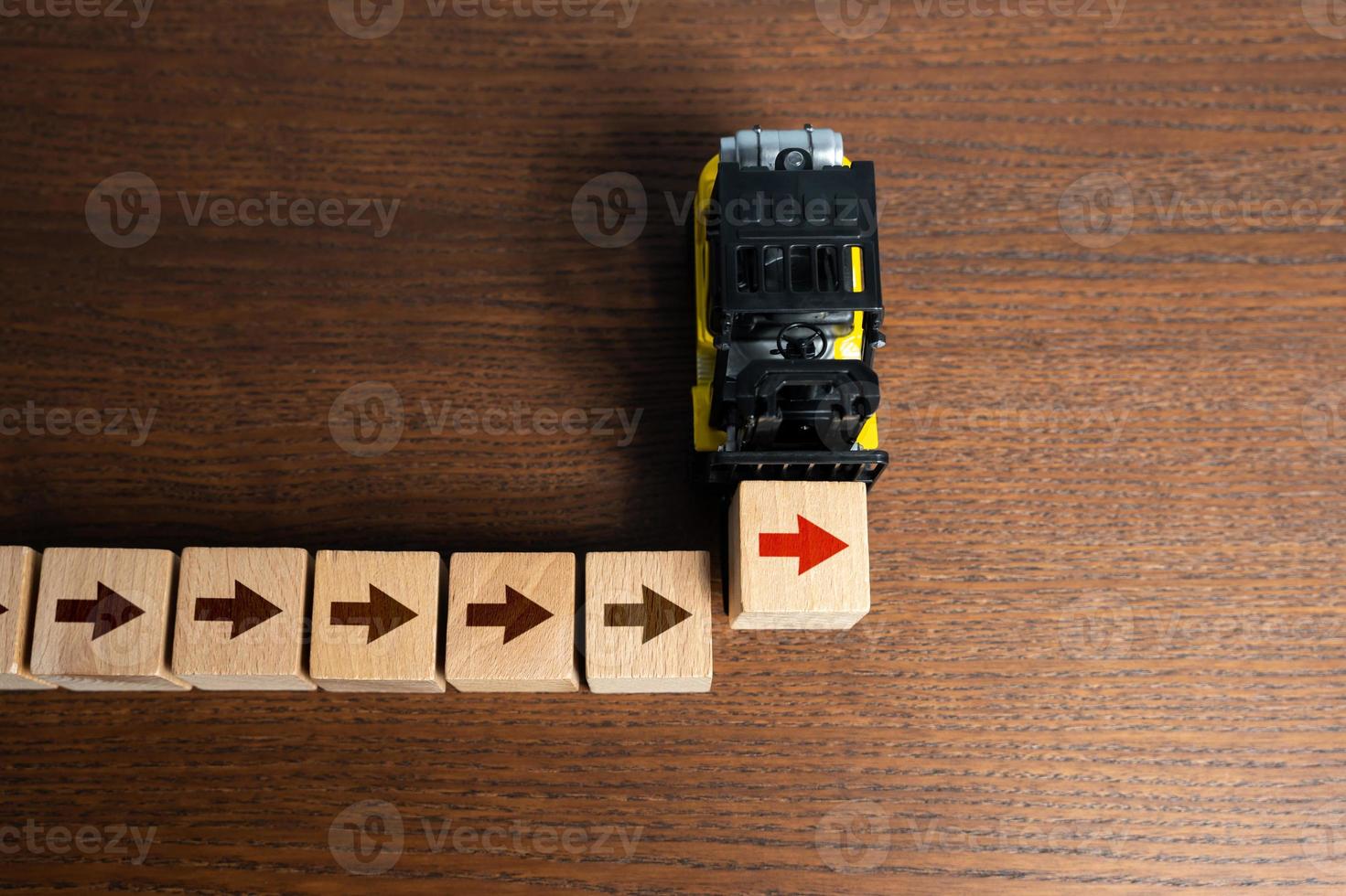 Forklift truck build workflow. Pave the way with arrows. Make way forward. Movement towards goal, firmness of intentions. Growth and development, building the future. Follow the course photo