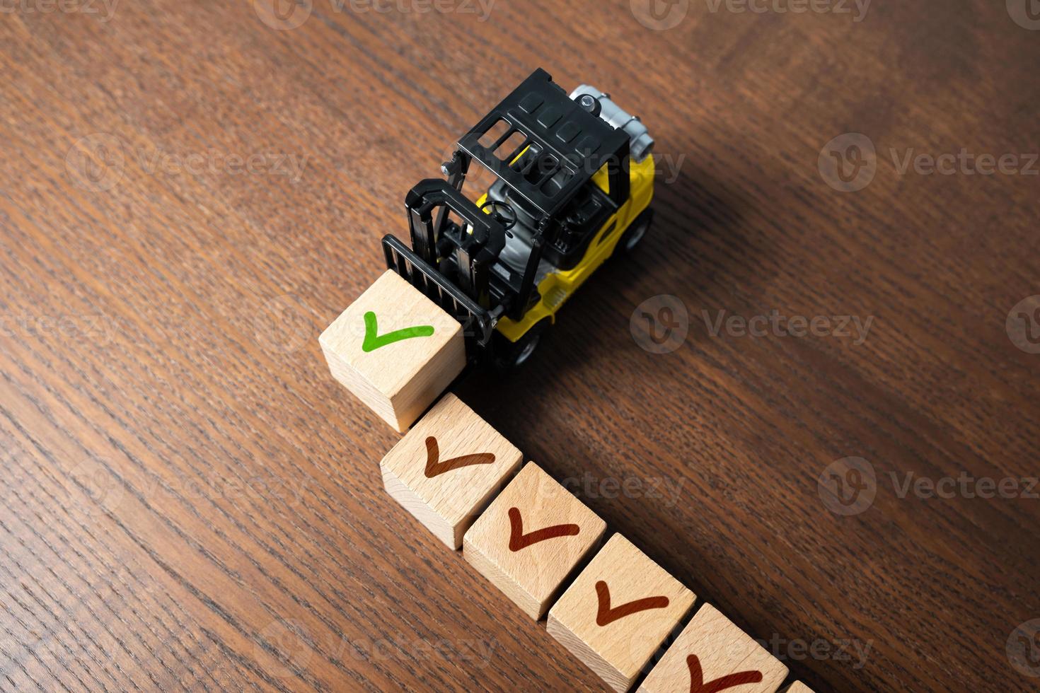 Forklift truck performs completes the next stage of work. Delivery contract confirmation. All systems are ready. Tasks completed, conditions met. Fact check. Series of correct decisions. photo