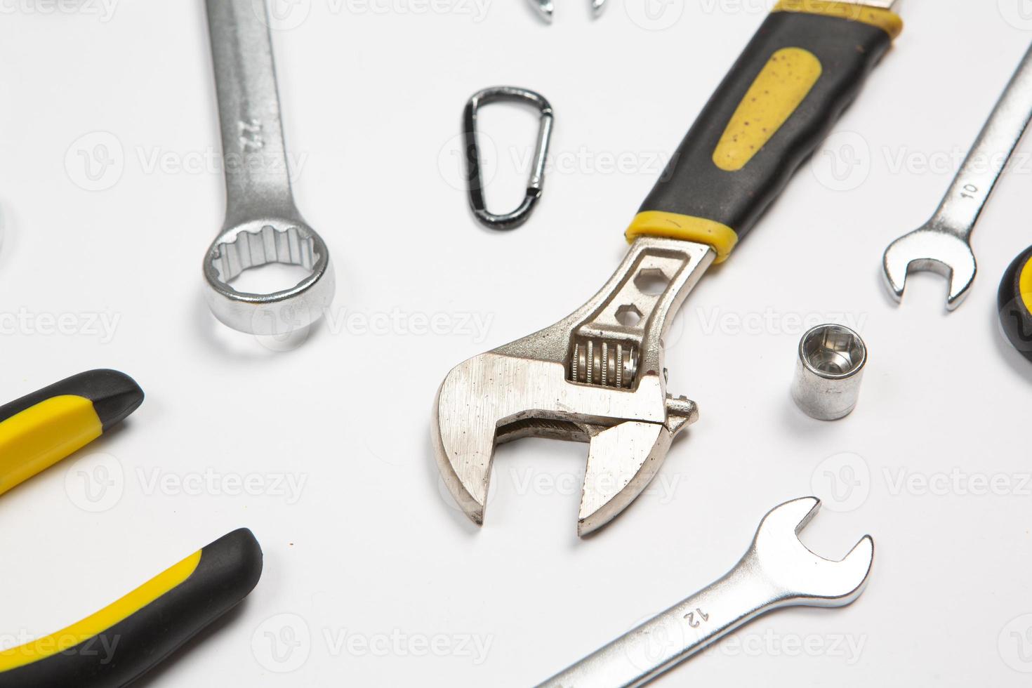 Set of tools for repair in a case on a white background. Assorted work or construction tools. Wrenches, Pliers, screwdriver. Top view photo