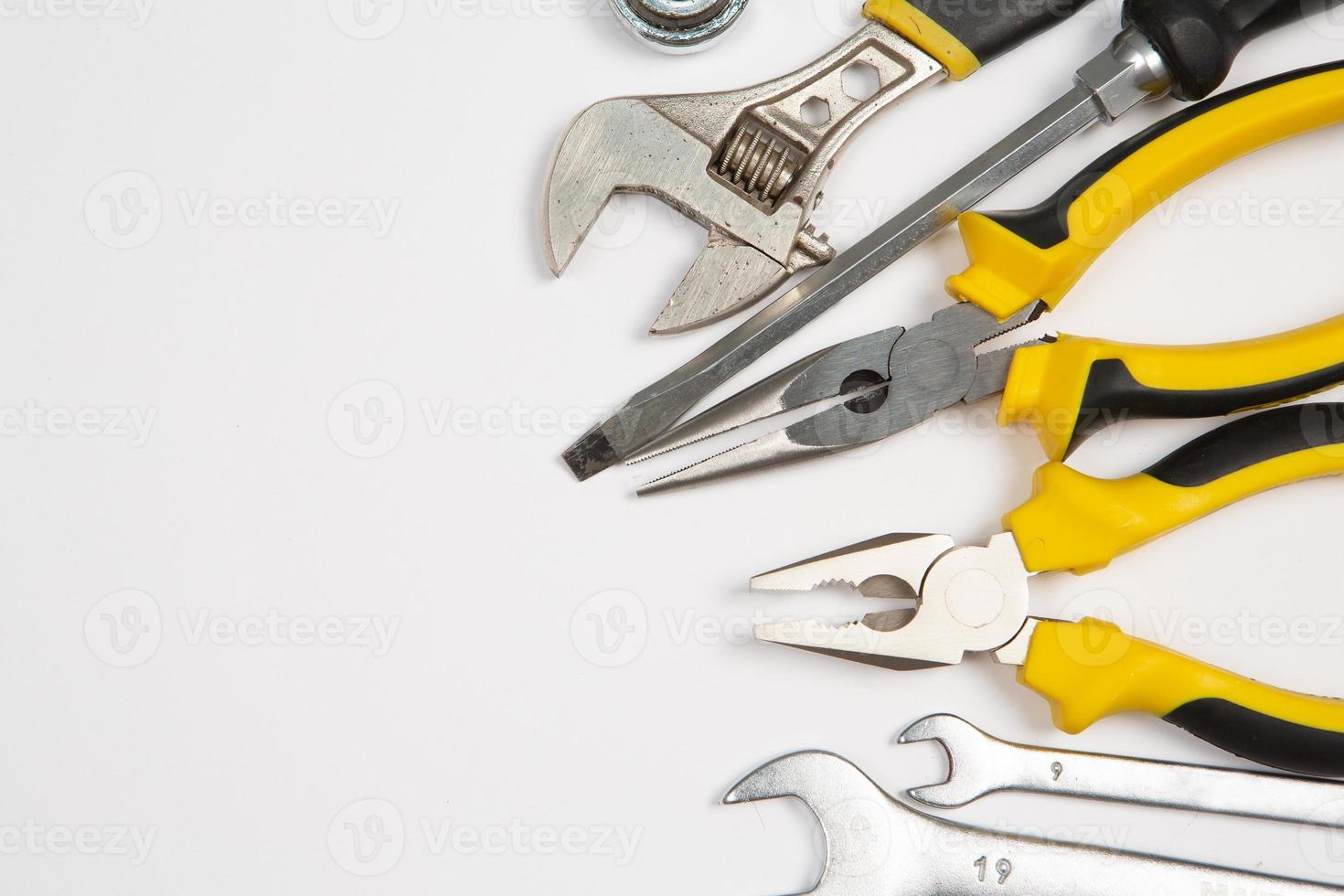 Set of tools for repair in a case on a white background. Assorted work or construction tools. Wrenches, Pliers, screwdriver. Top view photo