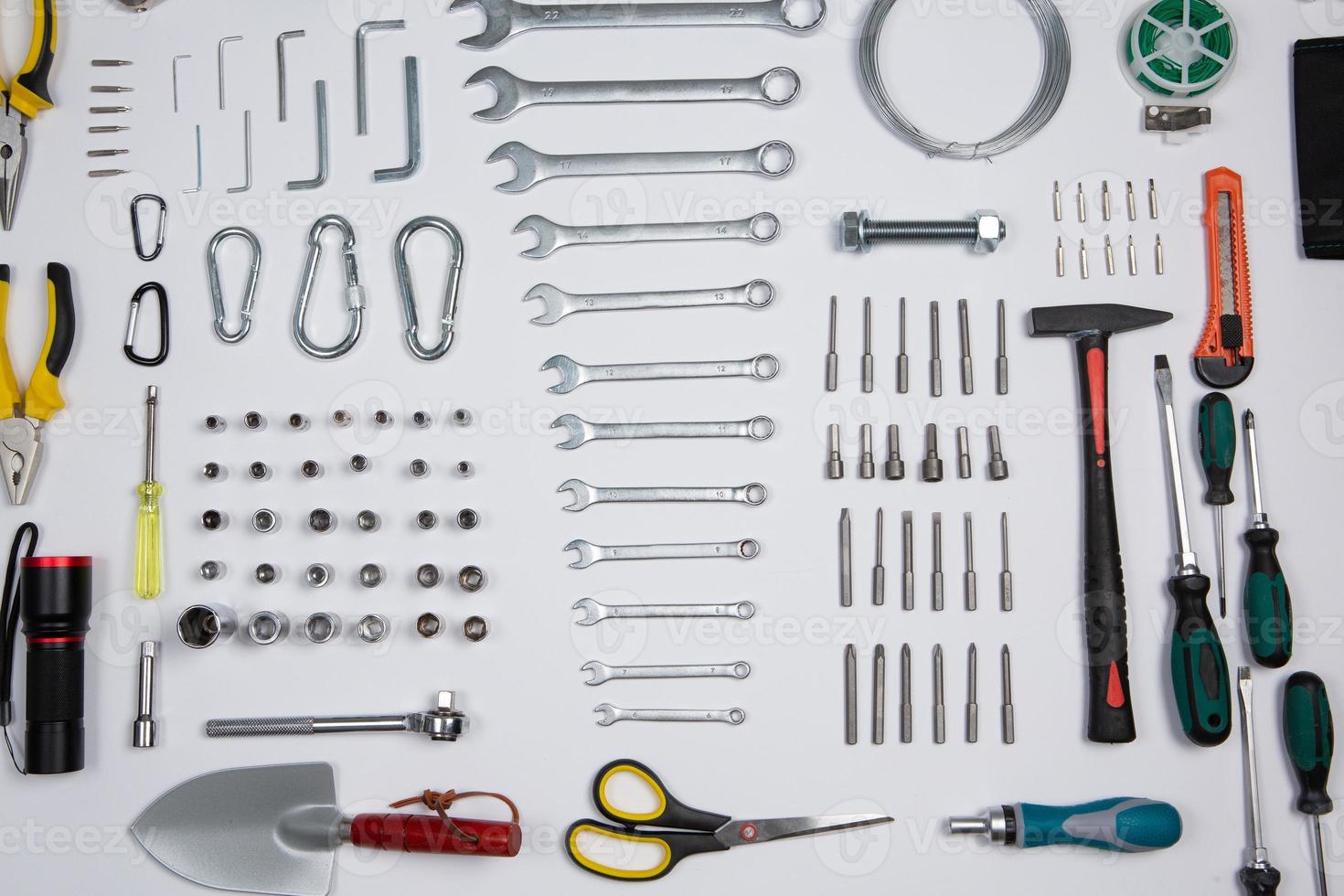 Set of tools for repair in a case on a white background. Assorted work or construction tools. Wrenches, Pliers, screwdriver. Top view photo