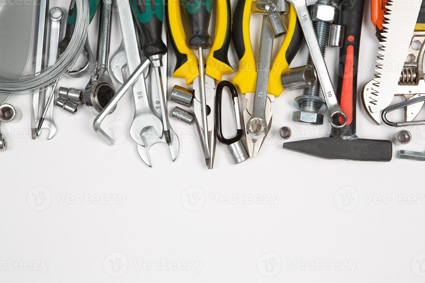 Set of tools for repair in a case on a white background. Assorted work or construction tools. Wrenches, Pliers, screwdriver. Top view photo