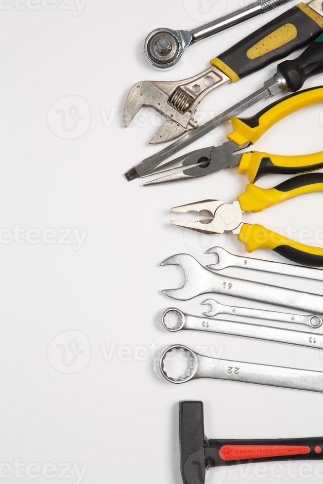 Set of tools for repair in a case on a white background. Assorted work or construction tools. Wrenches, Pliers, screwdriver. Top view photo