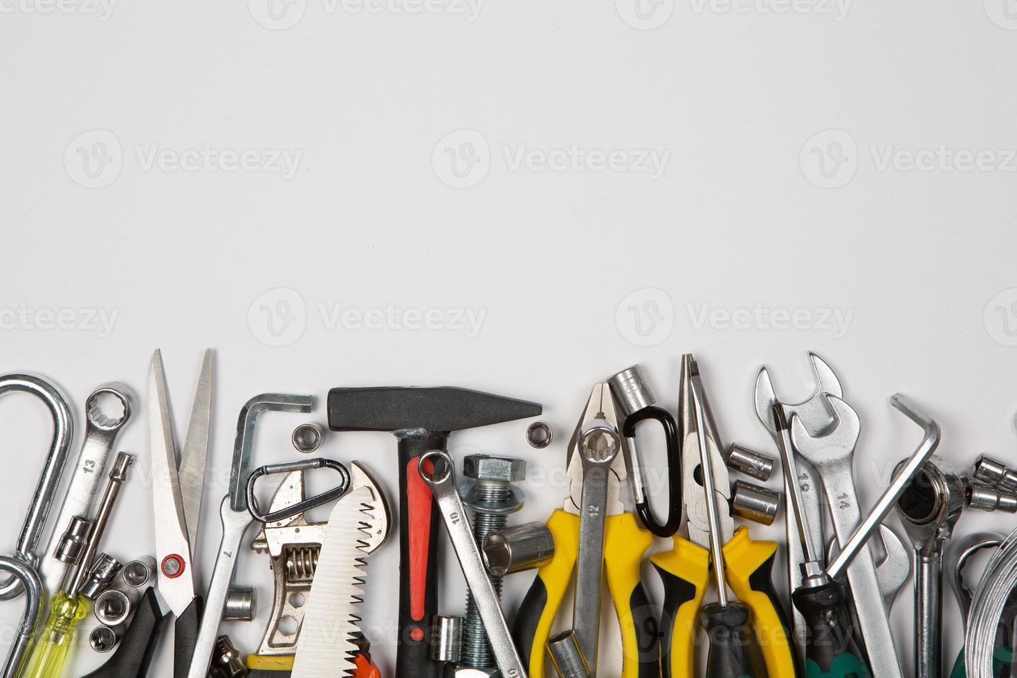 Set of tools for repair in a case on a white background. Assorted work or construction tools. Wrenches, Pliers, screwdriver. Top view photo