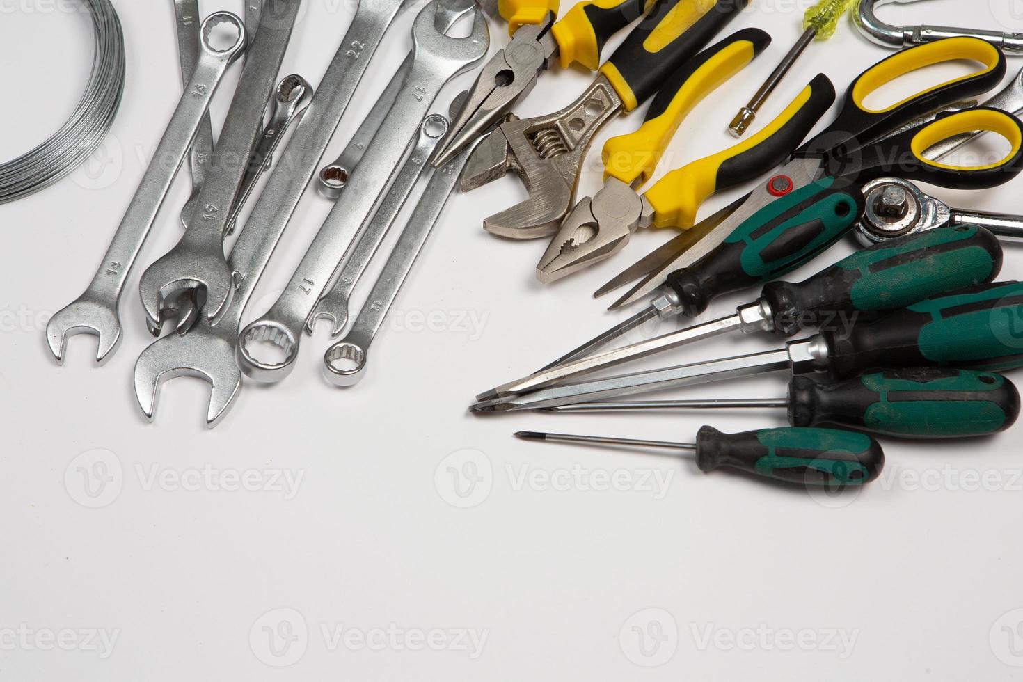 Set of tools for repair in a case on a white background. Assorted work or construction tools. Wrenches, Pliers, screwdriver. Top view photo