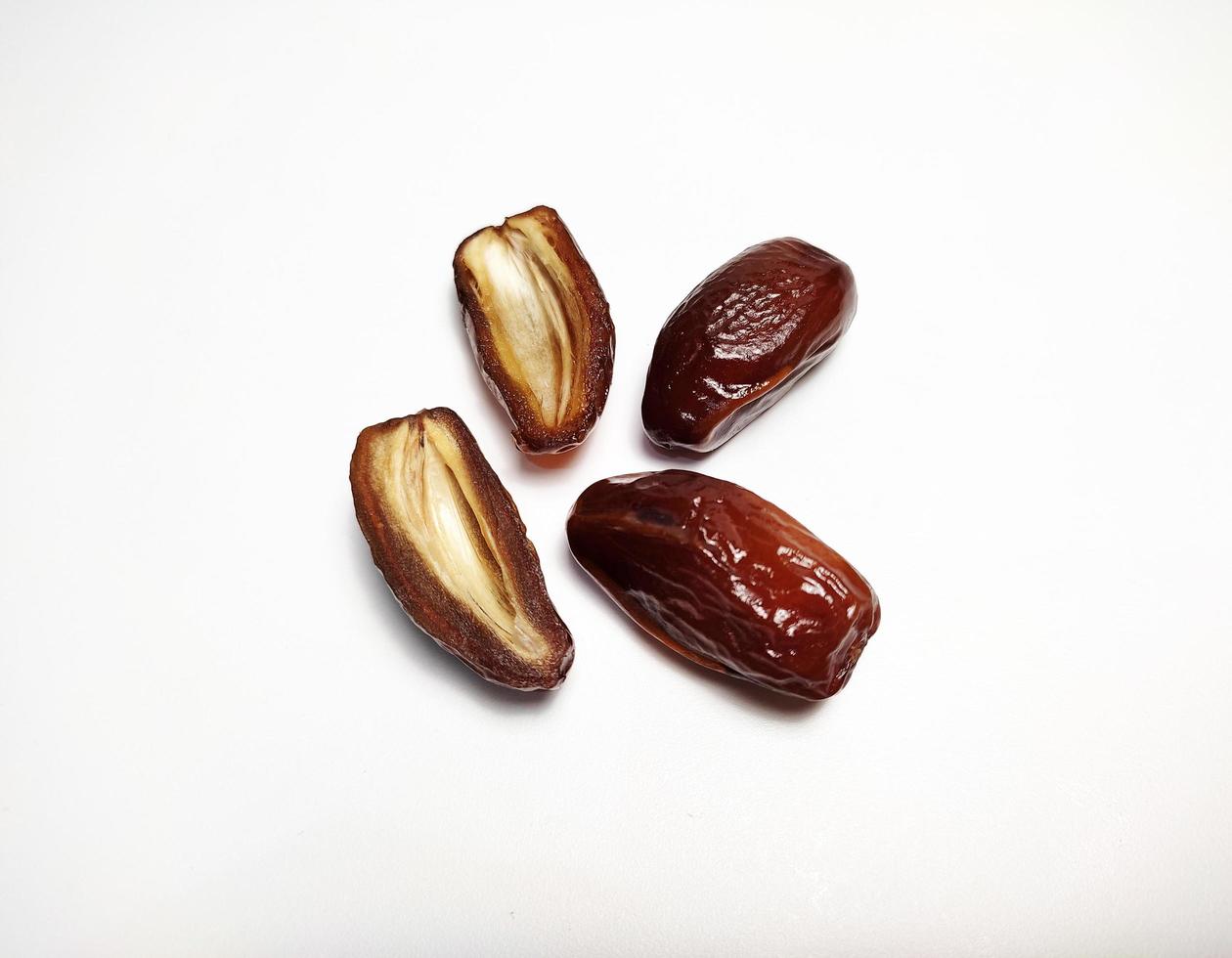Close up of dried dates fruit isolated on white background photo