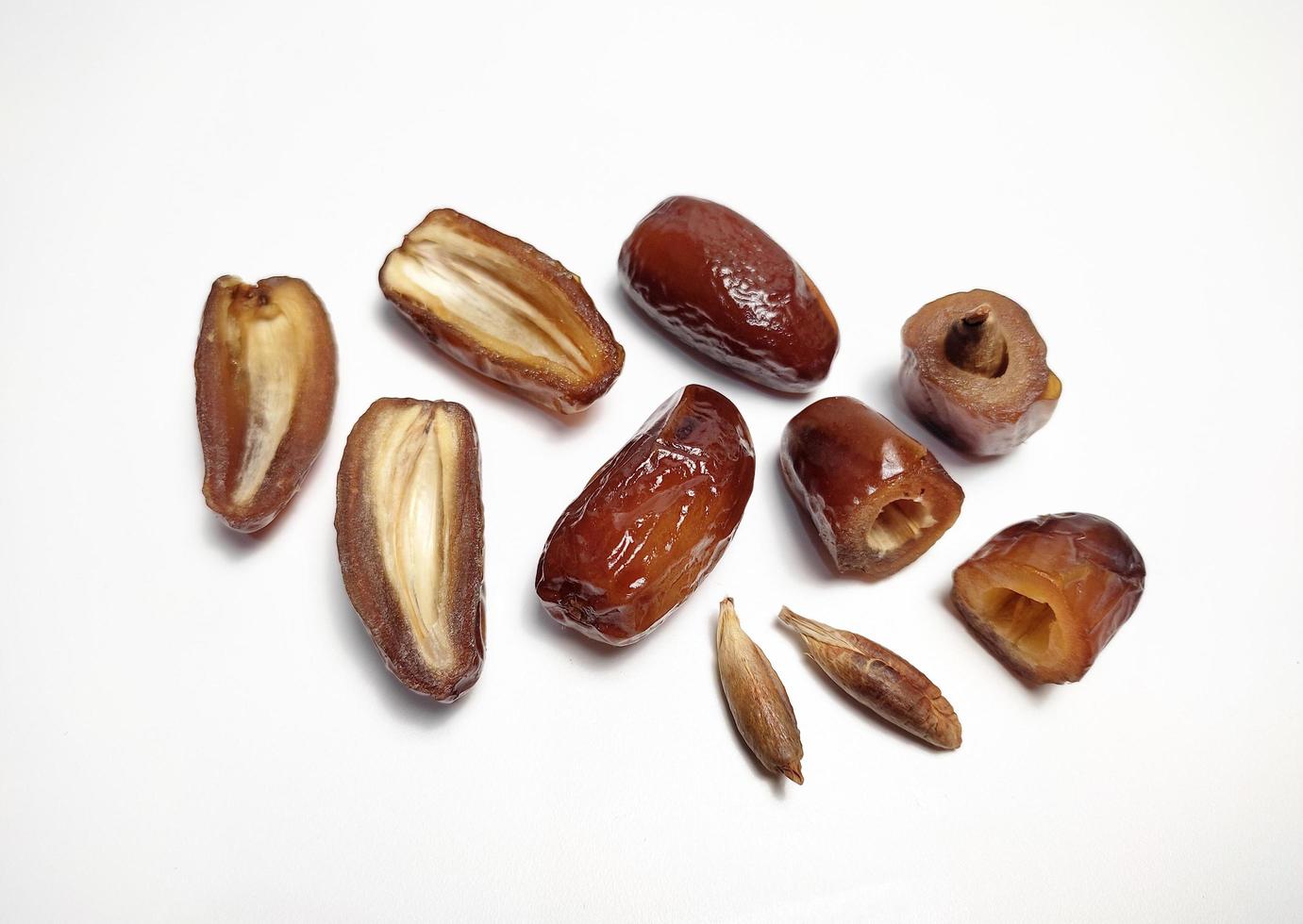 Close up of dried dates fruit isolated on white background photo