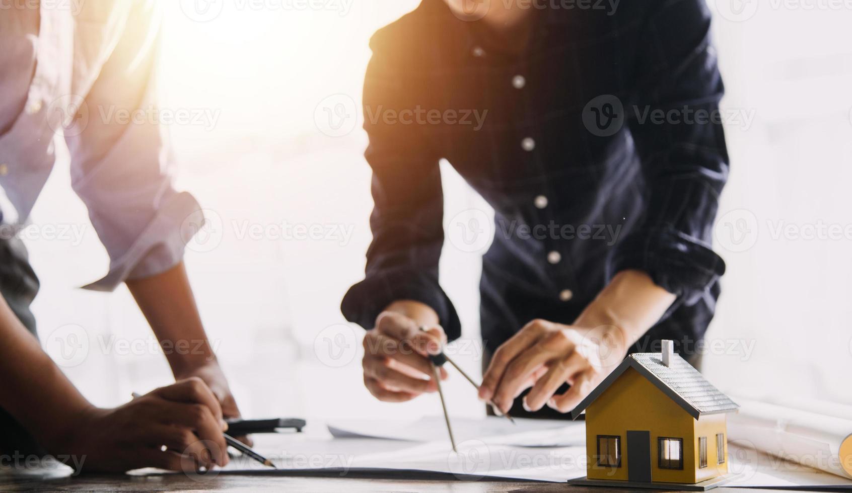 Architect concept, Architects working with blueprints in the office, Vintage Effect photo