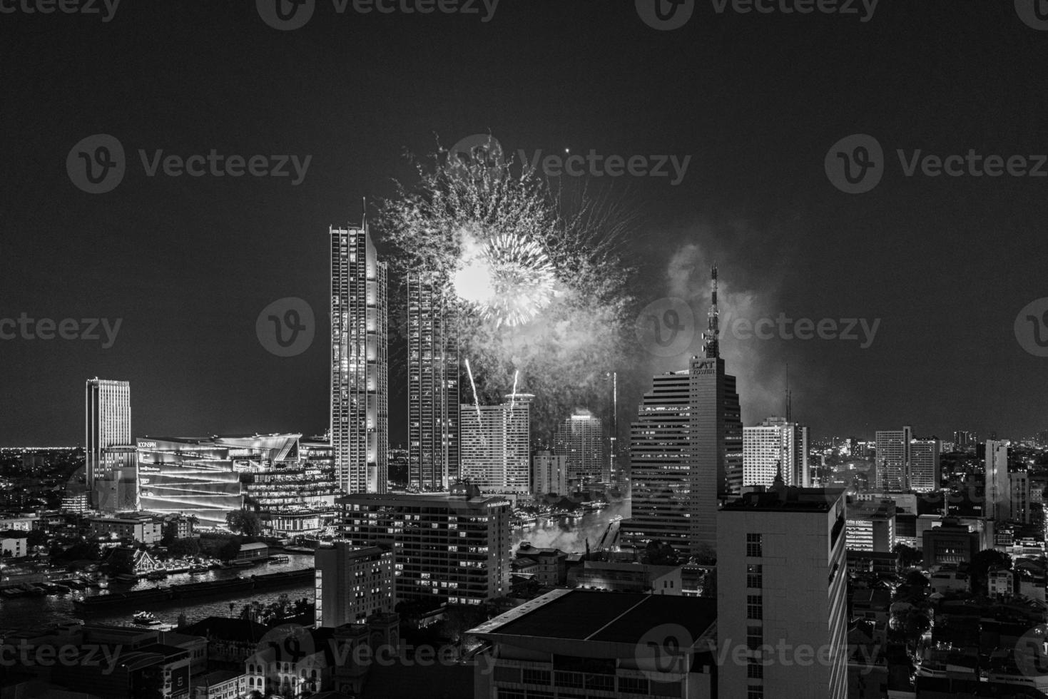 Aerial view of a fireworks display over the Chao Phraya River in Bangkok photo