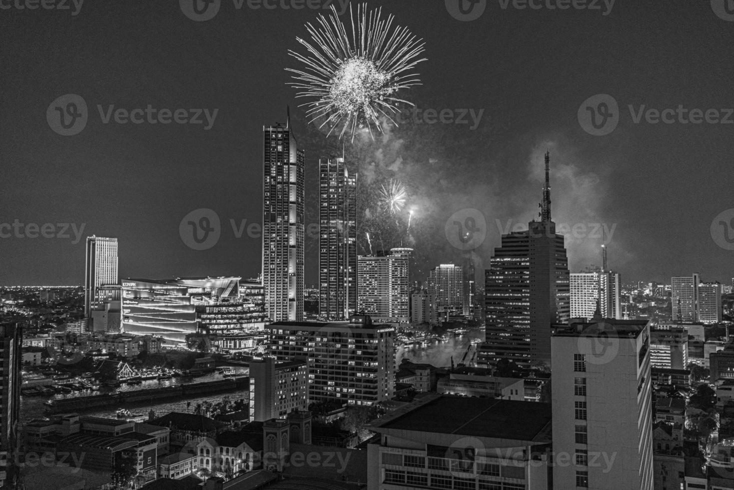 Aerial view of a fireworks display over the Chao Phraya River in Bangkok photo