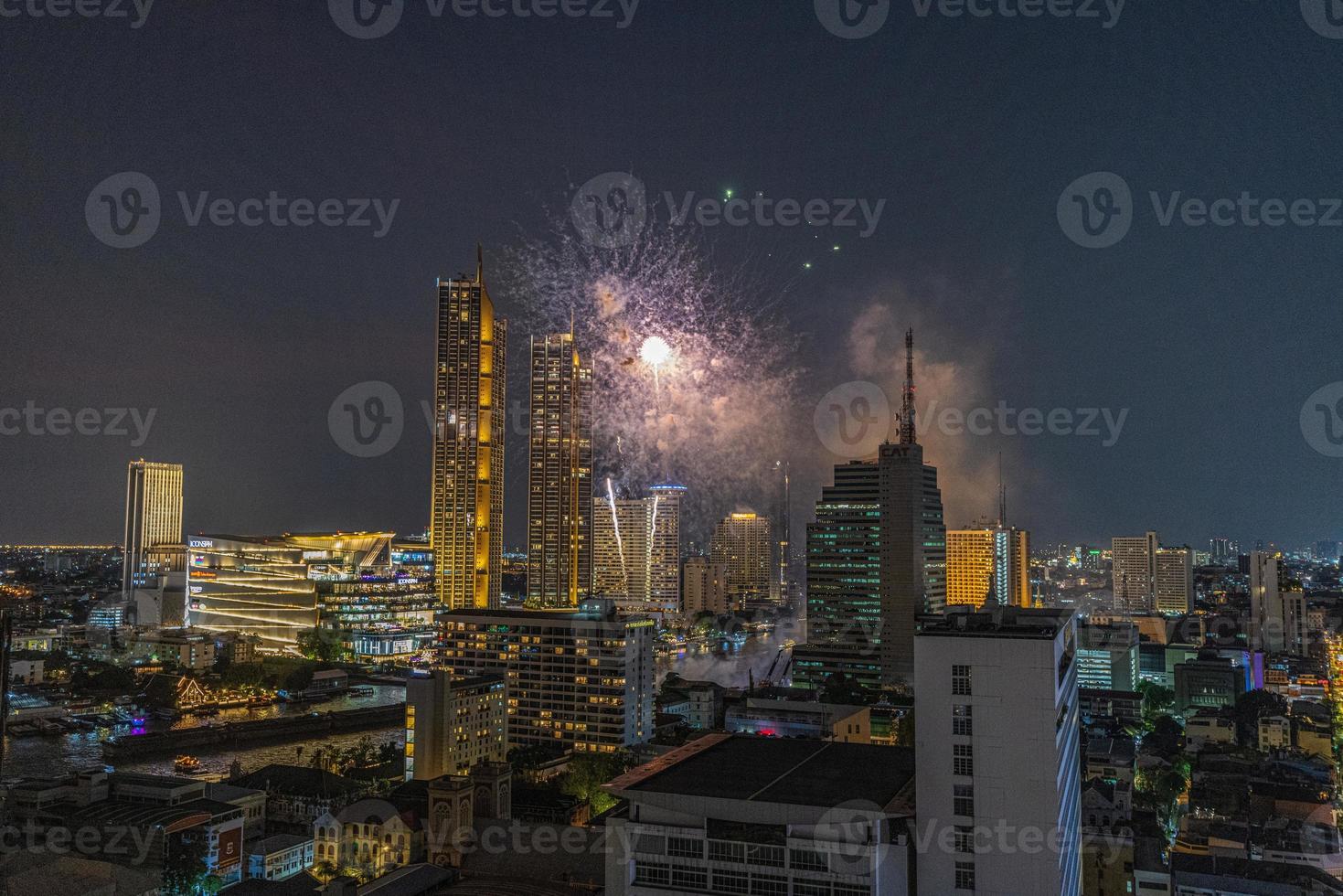 Aerial view of a fireworks display over the Chao Phraya River in Bangkok photo