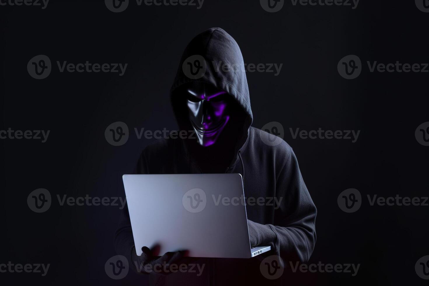 un hacker en un capucha utilizando un ordenador portátil computadora aislado en oscuro antecedentes con neón ligero. ai generado foto