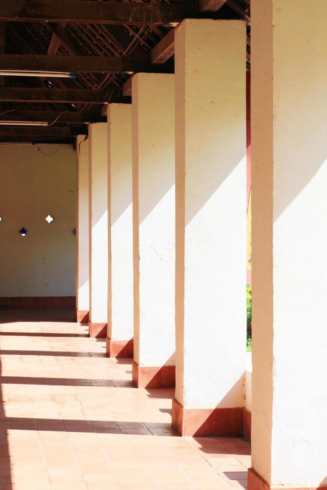 Beautiful sunlight shone down at the white pillar of the temple. photo