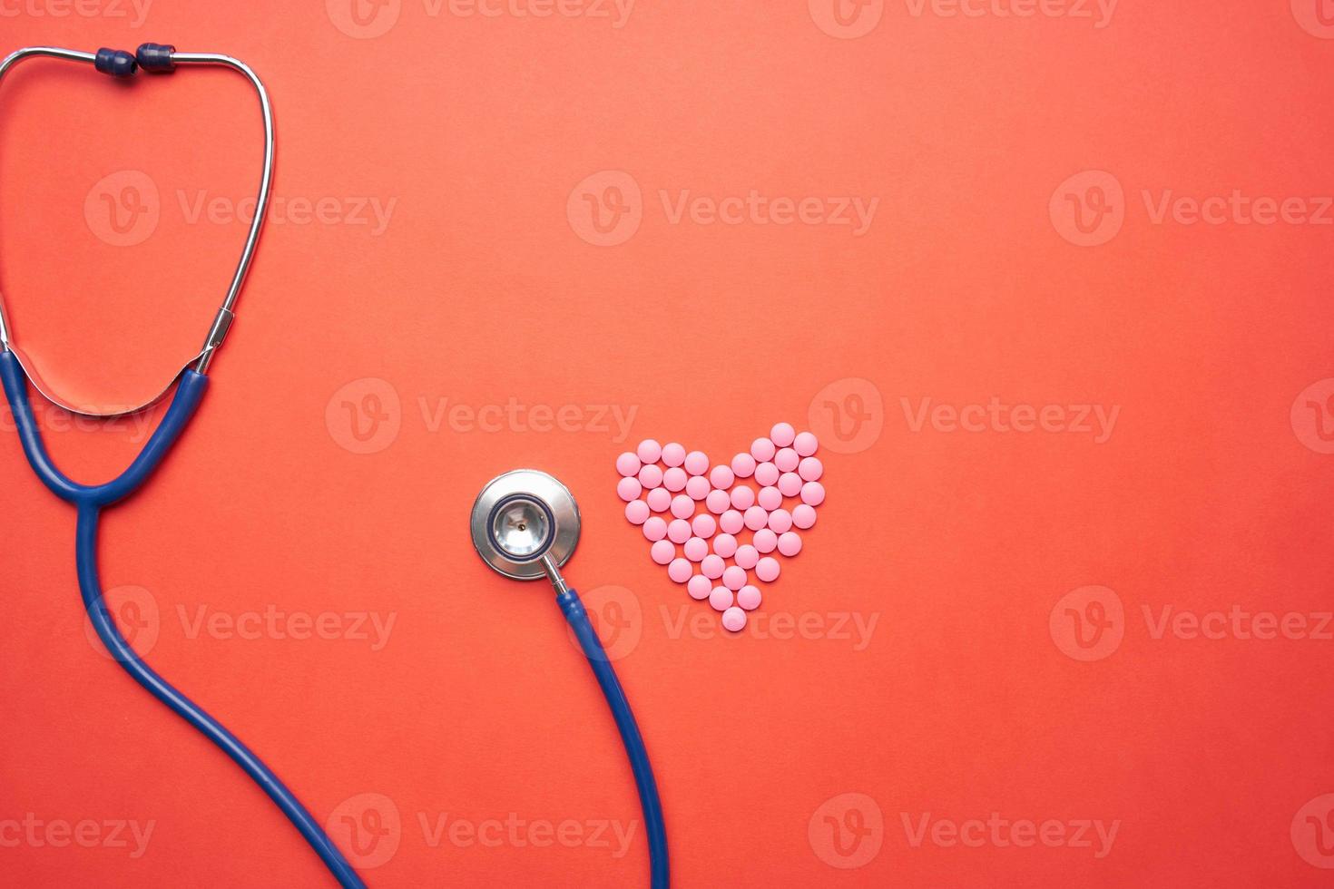 Stethoscope on red background photo