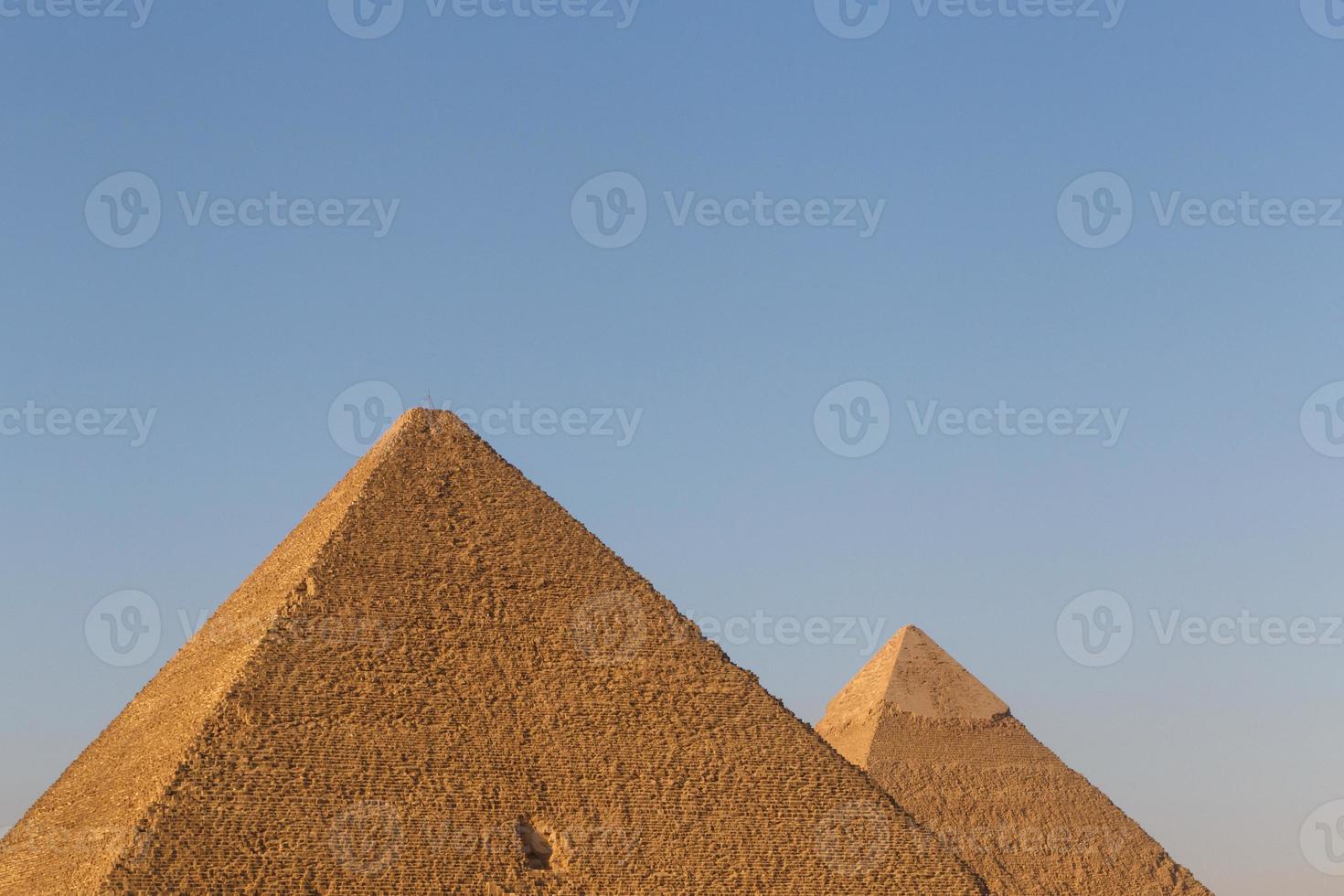 pyramids of Khufu and Khafre against blue sky photo