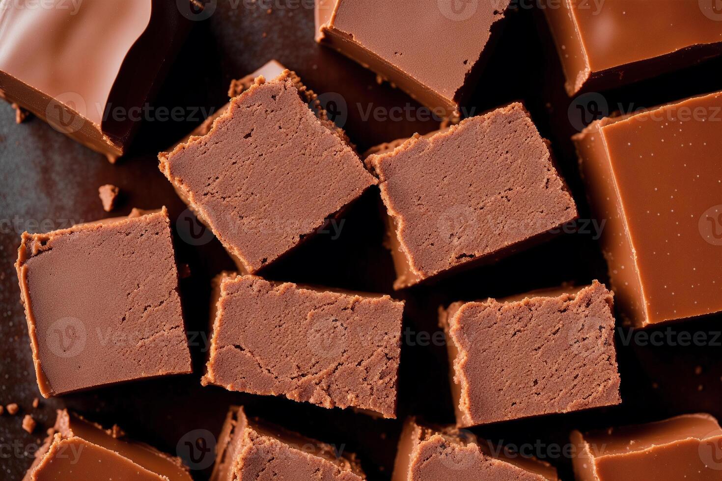 Fudge on a white plate on a wooden table. Homemade fudge cookies, candies with nuts. photo