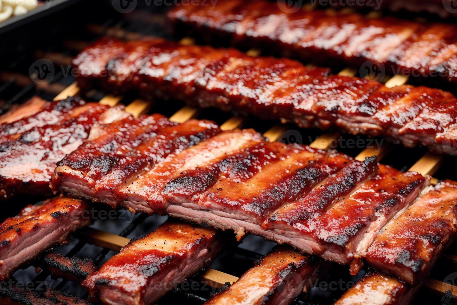 Grilled chicken wings with sweet and sour sauce on a white plate.Grilled sausages , Delicious barbecue ribs. photo
