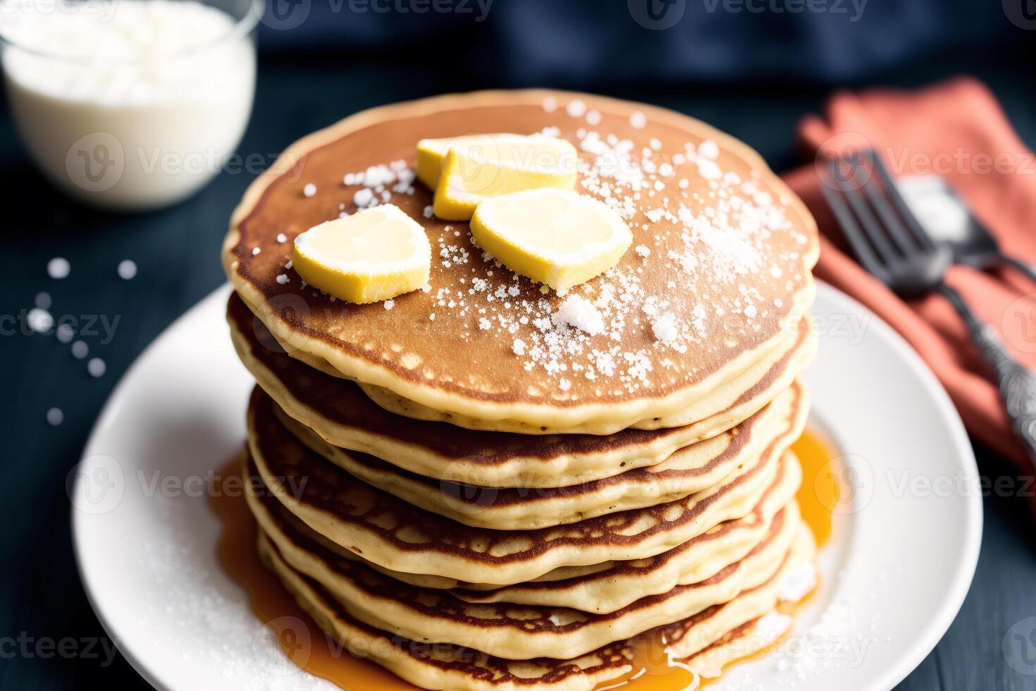 Stack of pancakes with maple syrup and sugar powder on a white plate. strawberries and whipped cream, photo