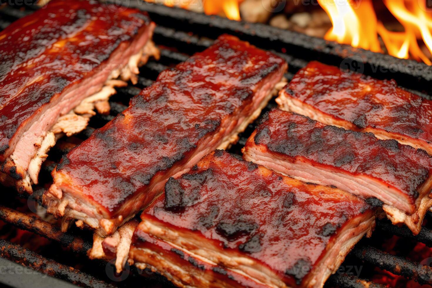 Grilled chicken wings with sweet and sour sauce on a white plate.Grilled sausages , Delicious barbecue ribs. photo