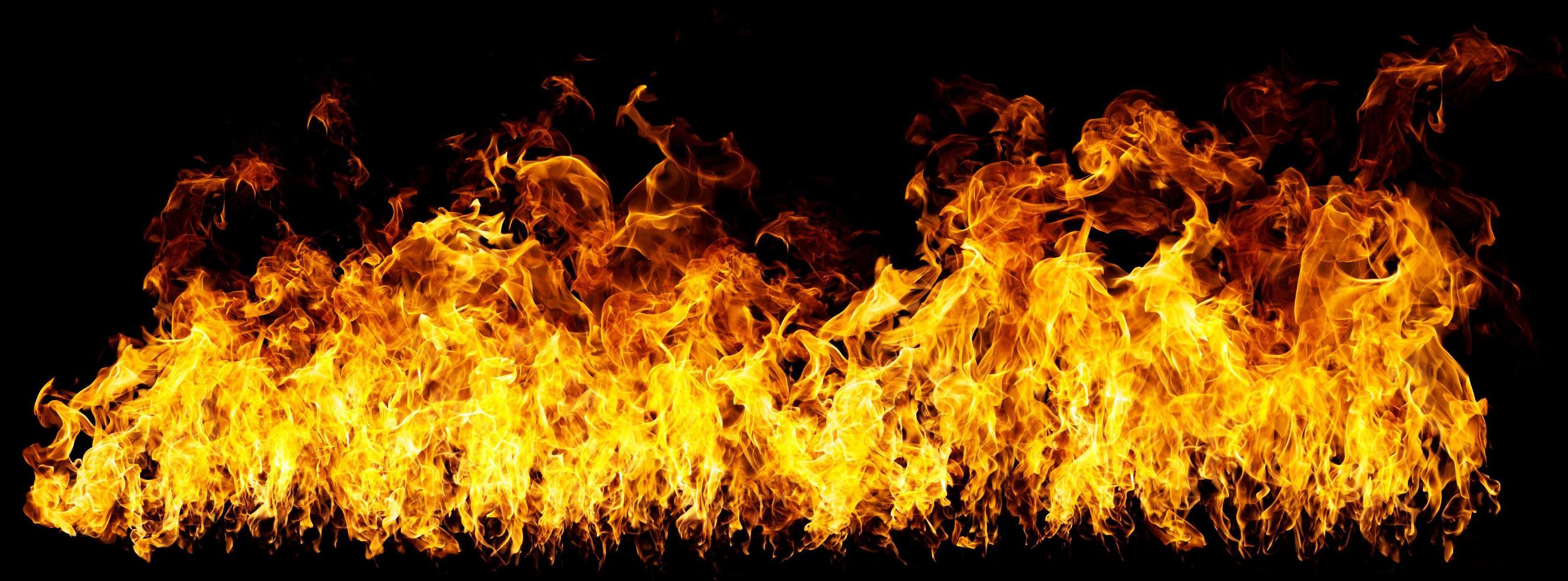 real firewalls and hot flames are burning on a black background. photo