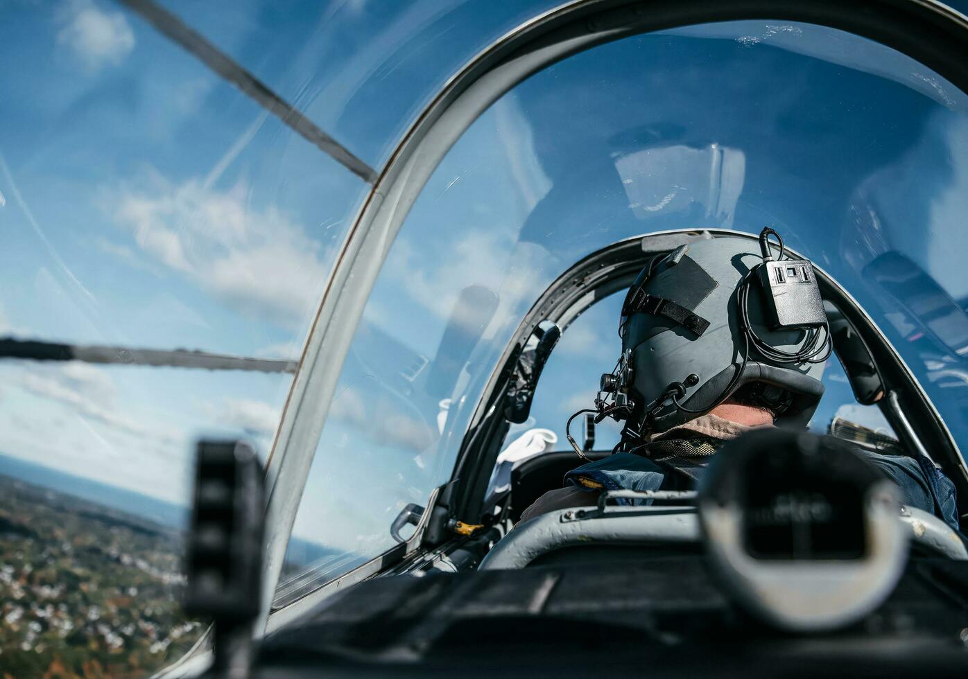 Pilot Wearing Mask And Helmet.  Elements of this image furnished by NASA. photo