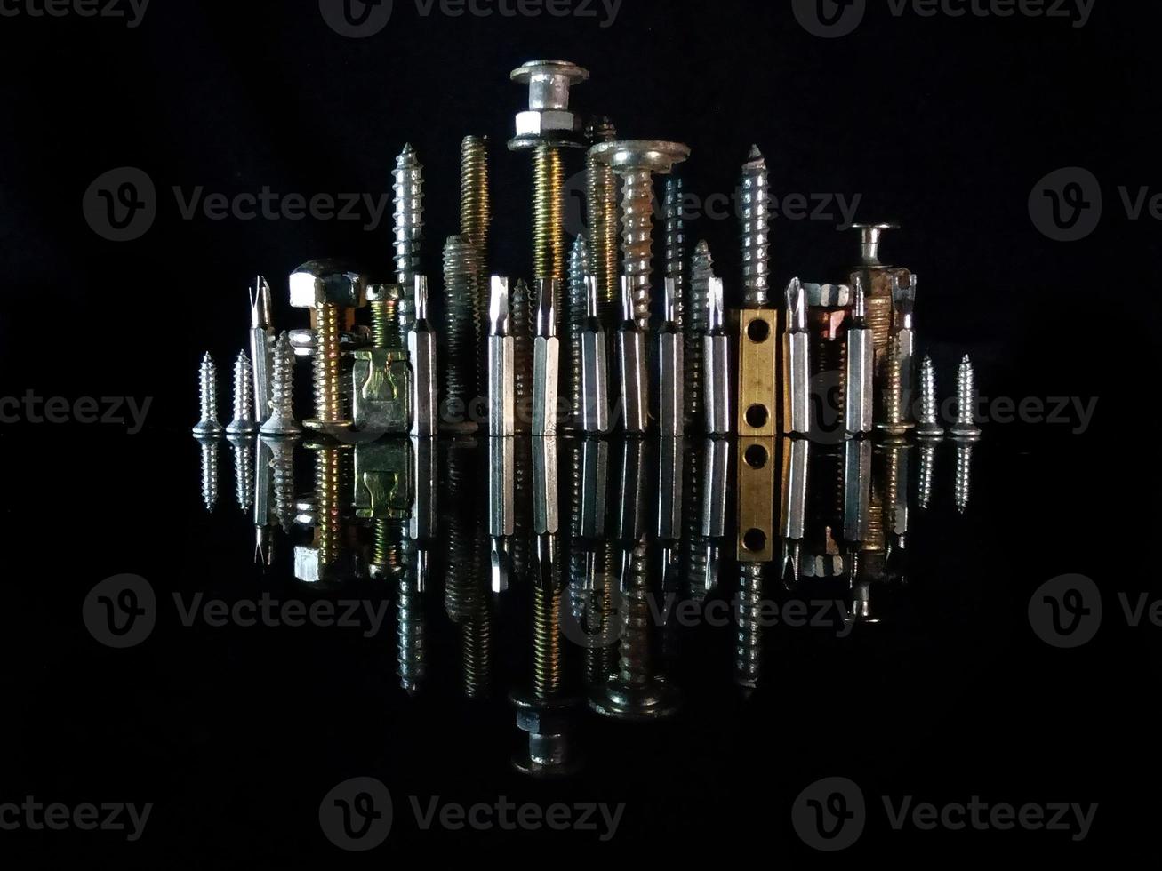 neatly arranged used screws photo