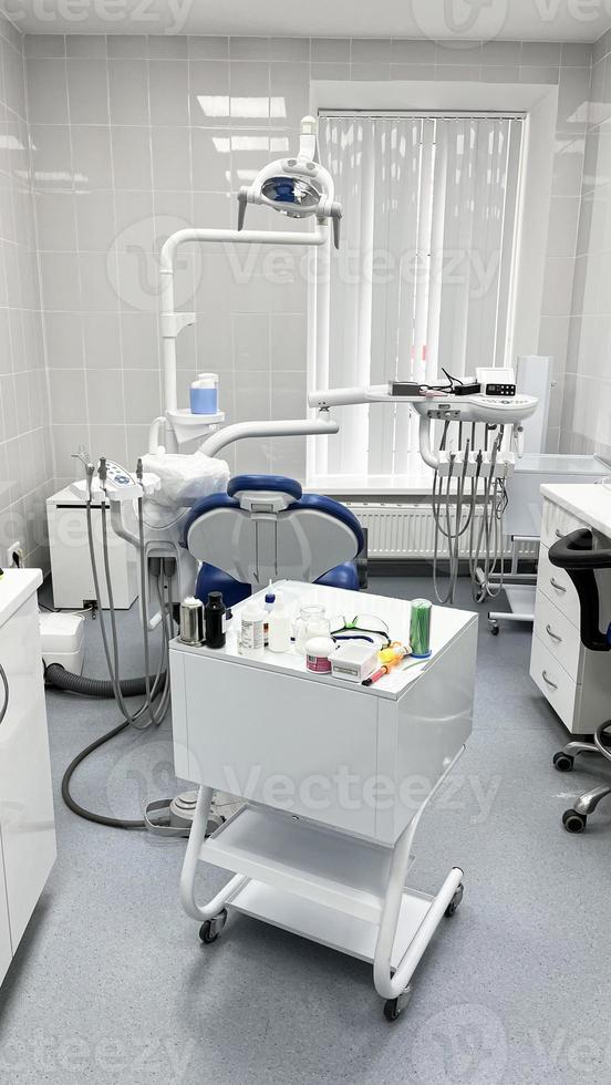Dental office and dental chair for dental treatment. photo