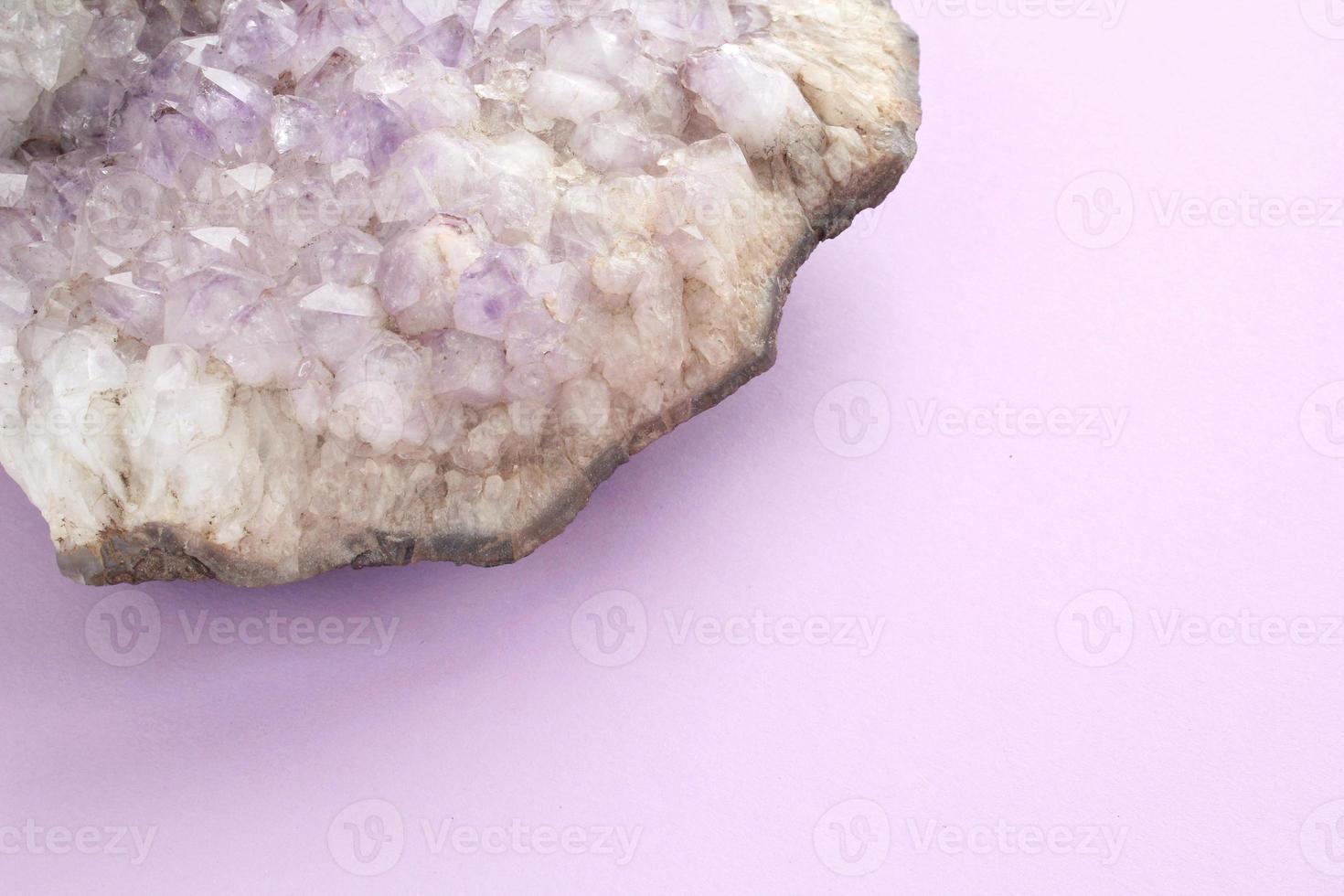 Natural violet amethyst druse geode mineral crystal unpolished semi-precious gemstone. Magic rock for ritual, witchcraft, spiritual practice, meditation. Esoteric life balance concept. Copy space photo