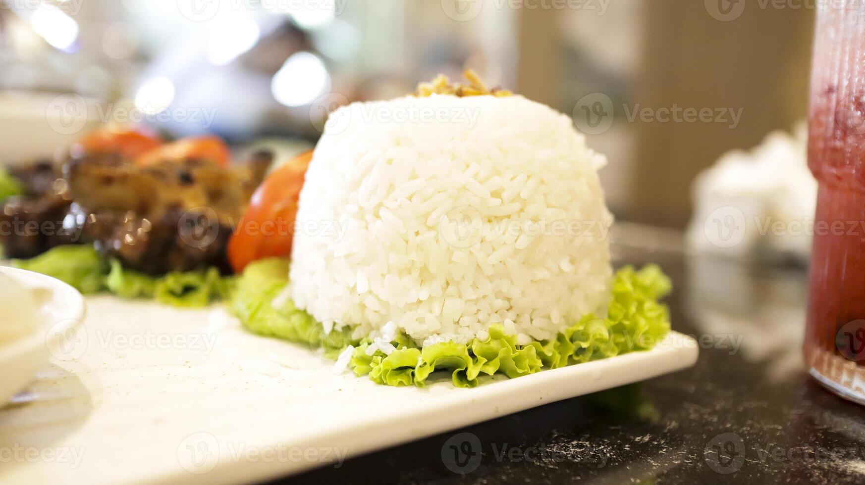 White rice at the plate must have food in most Asia. photo