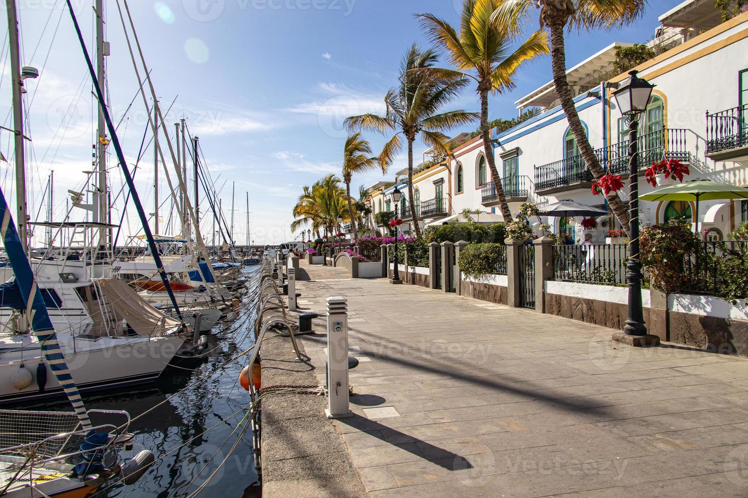 landscape with a port with yachts in the Spanish city of Puerto Rico on the Canary Island of Gran Canaria photo