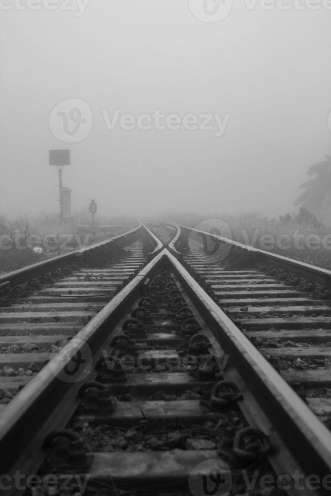 railway in winter is foggy as the lane changes. The walk is delayed due to reduced visibility, not suitable for walking anywhere and everywhere in Thailand. photo