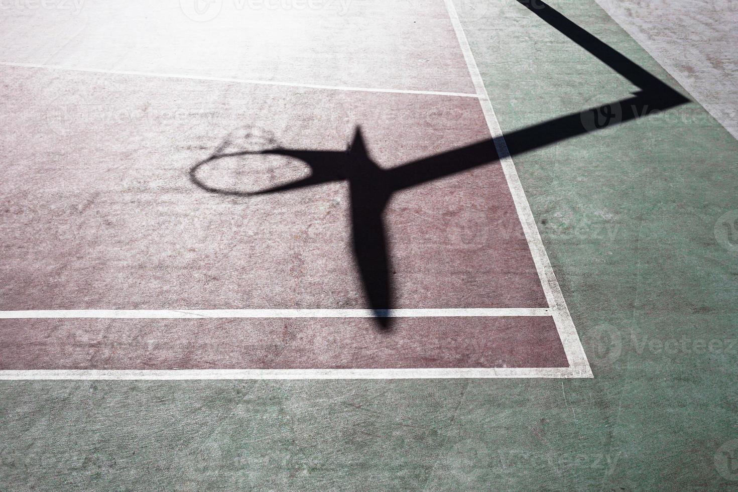 basketball hoop shadow on the basketball court photo