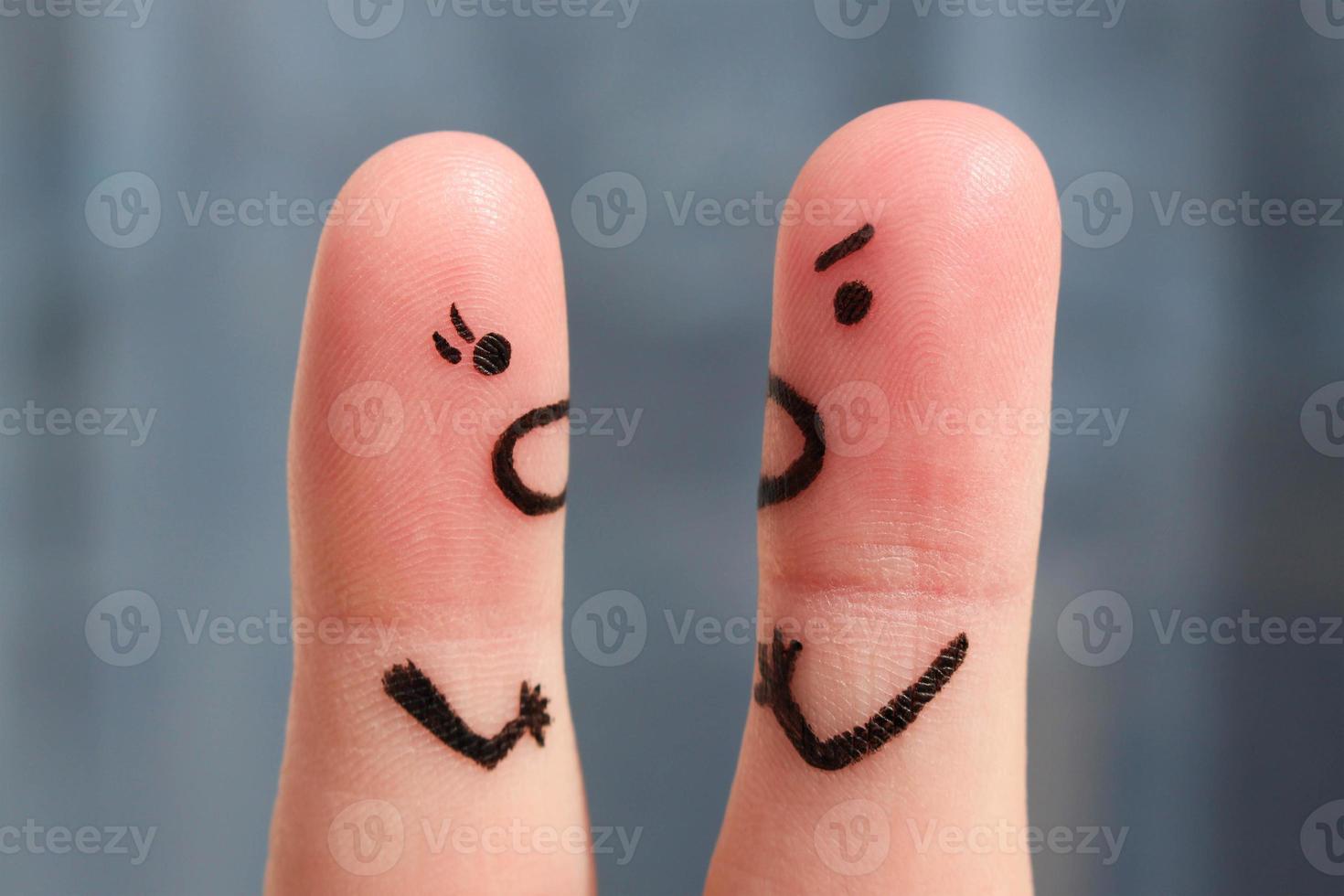 Finger art of a couple during quarrel. The concept of a man and woman yelling at each other. photo