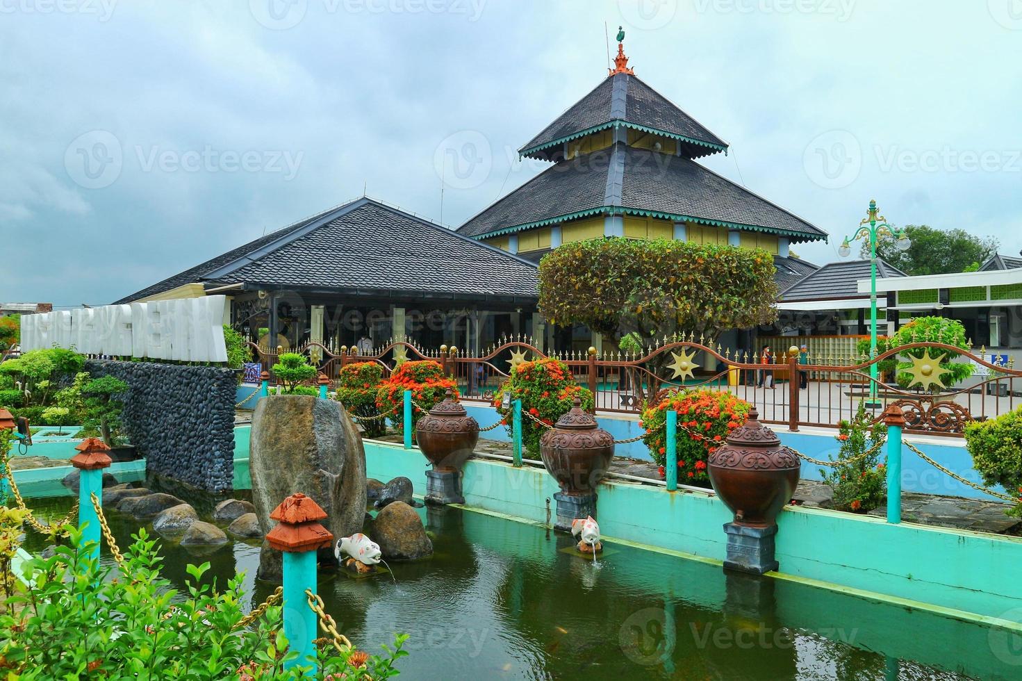 the great mosque of demak with the background of the blue sky standing majestically is a site protected by the government photo